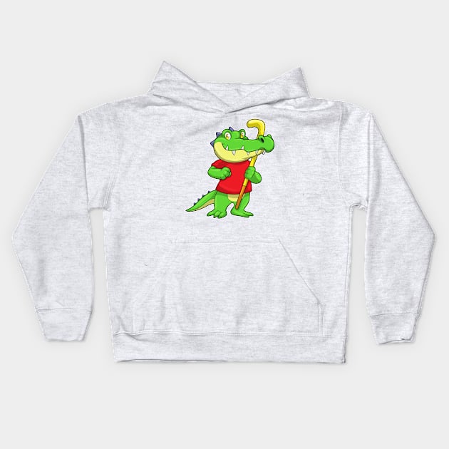 Crocodile at Field hockey with Hockey stick Kids Hoodie by Markus Schnabel